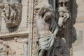 The marvellous lion statue in front of Duomo milano, The mistery line head statue in front of Famous white Architectural cathedral