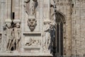 The marvellous lion statue in front of Duomo milano, The mistery line head statue in front of Famous white Architectural cathedral