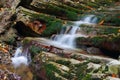 Marvellous rocks with a moss and flowing streams of mountain creek