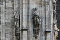 The marvellous statue are decorating on the white wall surrounding Duomo milano, The mistery art on external building