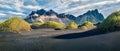 Marvelous afternoon view of Stokksnes cape with Vestrahorn Batman Mountain on background. Panoramic summer landscape with black