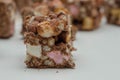 A marvelous mix of sultanas, marshmallows, biscuit pieces, crispy rice and glacÃÂ© cherries covered in milk chocolate