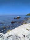 Marvelous view of white and black stones on the beach during low tide in Manatuto beach, Timor-Leste.