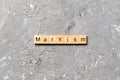 Marxism word written on wood block. marxism text on table, concept Royalty Free Stock Photo