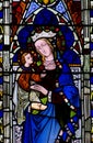 Mary with baby Jesus in her arms (stained glass) Royalty Free Stock Photo