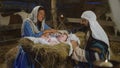 Mary and Joseph speaking and taking care of baby Jesus Royalty Free Stock Photo
