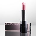 Mary Kay cosmetics isolated on gradient background.