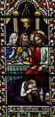 Mary Magdalene washing the feet of Jesus in stained glass Royalty Free Stock Photo