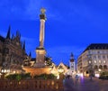 Mary's Square illuminated at dusk with the Old City Hall on the background in Munich