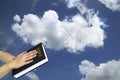 Mary in white clouds with light raywith human hands praying with bible