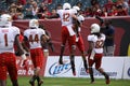 Maryland players jump high to celebrate a touchdown