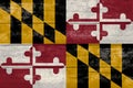 Maryland State flag on a wooden surface. Banner of the grunge Maryland State flag Royalty Free Stock Photo