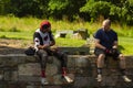 Two friends are talking after a tough mountain cycling tour Royalty Free Stock Photo