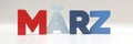 Marz -March - month in German 3d plastic color palette with red, blue and white, text typography