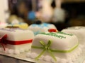 Marzipan Covered Decorated cakes in display