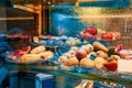 marzipan fruit on display. Marzipan assortment. Sweet marzipan with colorful fruit shapes, in the window of a sweet shop