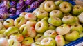 Marzipan fruits assortment. Close up of marzipan sweets shaped and painted as flat peach in patisserie shop. Martorana