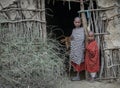 Masai kids at a door of their home