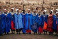 Masai or Maasai tribe woman in blue cloth wearing headpiece and ornaments. Ethnic group of Ngorongoro Consevation, Serengeti in