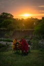 Masai Mara, Kenya, Africa Ã¢â¬â August 10, 2018: A group of Masai men in traditional clothes resting at dawn after a long night