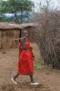 MASAI MARA, KENYA - September, 23: Young Masai woman with ax on Royalty Free Stock Photo