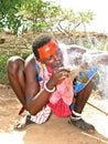 Masai people making fire with straw Royalty Free Stock Photo