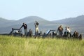 Masai scout and tourists look for animals from a Landcruiser during a game drive at the Lewa Wildlife Conservancy in North Kenya, Royalty Free Stock Photo