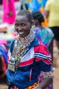 Masai tribe traditional dressed young woman smiling in Africa
