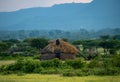 Masai village near Ngorongoro crater and Mto Wa Mbu. Small Masai huts in African savanna, Tanzania Royalty Free Stock Photo