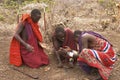 Masai warriors lighting fire Royalty Free Stock Photo