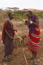 Masai warriors lighting fire Royalty Free Stock Photo