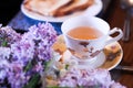 Masala chai tea of india with bread, butter and lilac flower Royalty Free Stock Photo