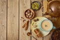 Masala chai tea traditional indian drink  with milk and spices on wooden backgraound. Top view from above Royalty Free Stock Photo