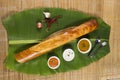 Masala dosa on banana leaf with both sambar and coconut chutney Royalty Free Stock Photo