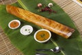 Masala dosa on banana leaf with both sambar and coconut chutney Royalty Free Stock Photo