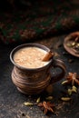 Masala pulled tea chai latte hot Indian sweet milk spiced drink, cinnamon stick, ginger, fresh spices and herbs blend Royalty Free Stock Photo