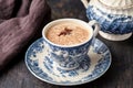 Masala tea chai latte traditional warm Indian sweet milk with spices, cinnamon stick, ginger herbs blend