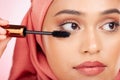Mascara brush, beauty and face of Muslim woman with studio cosmetics tools, skincare wellness and grooming lashes