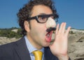 Mascked man shouting with groucho marx glasses Royalty Free Stock Photo