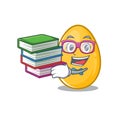 Mascot cartoon of golden egg studying with book Royalty Free Stock Photo