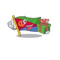 Mascot cartoon of happy flag eritrea with gift box