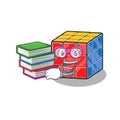 Mascot cartoon of rubic cube studying with book