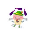 Mascot cartoon style of strawberry cupcake playing Juggling on stage