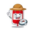 Mascot design concept of blood plastic bag explorer using a compass in the forest