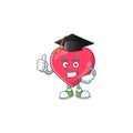 Mascot design concept of heart medical notification proudly wearing a black Graduation hat Royalty Free Stock Photo