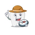Mascot design concept of tooth explorer using a compass in the forest Royalty Free Stock Photo