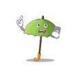 Mascot design of green umbrella speaking on phone Royalty Free Stock Photo