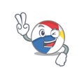 Mascot of funny beach ball cartoon Character with two fingers