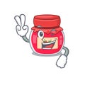 Mascot of funny strawberry jam cartoon Character with two fingers Royalty Free Stock Photo