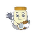 A mascot picture of coconut butter cartoon as a Doctor with tools Royalty Free Stock Photo